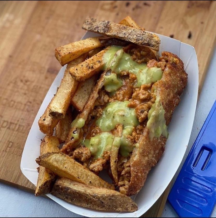 Loaded fries with taco meat and avocado sauce