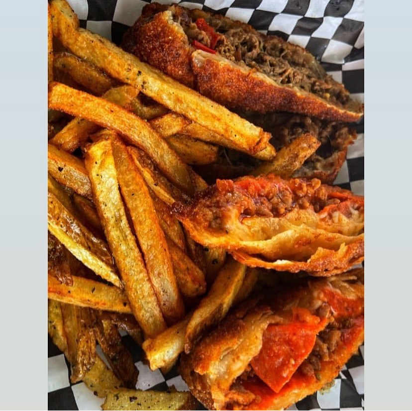 Philly cheesesteak and pizza eggrolls with fresh cut seasoned fries