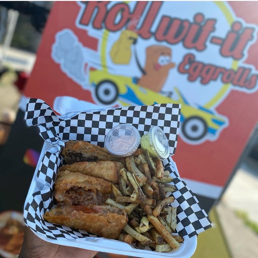 Eggroll combo tray with fries and two dipping sauces at the pop-up