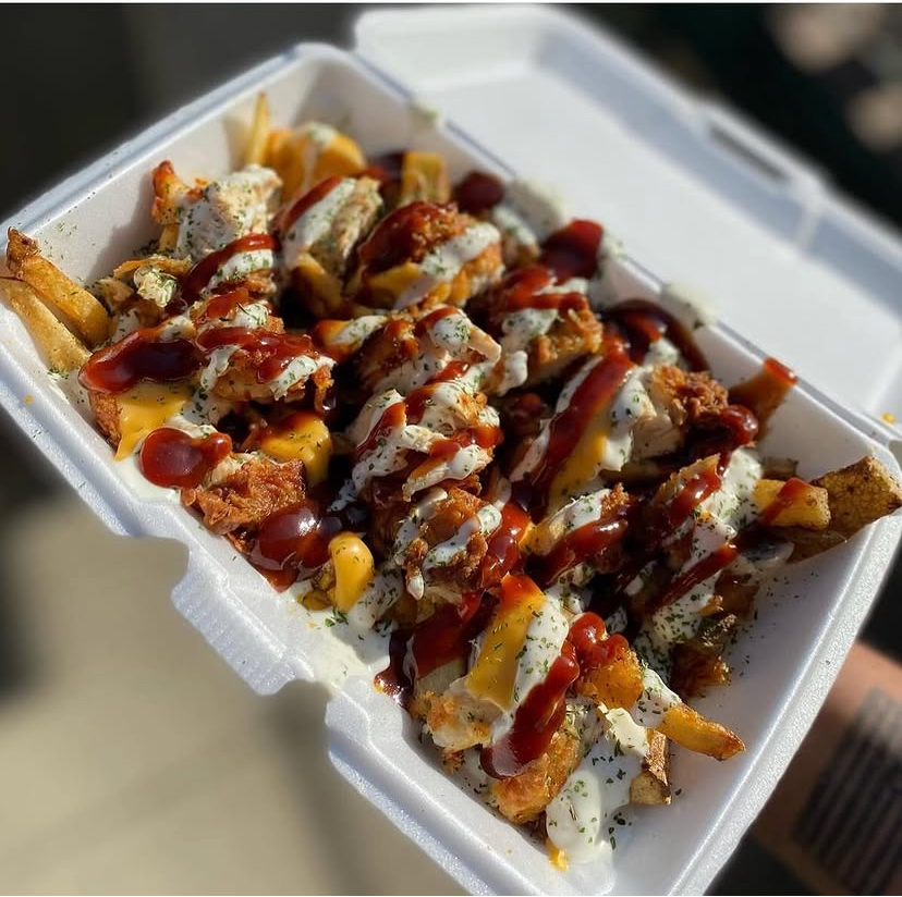 Loaded fries topped with chicken, cheese and BBQ sauce